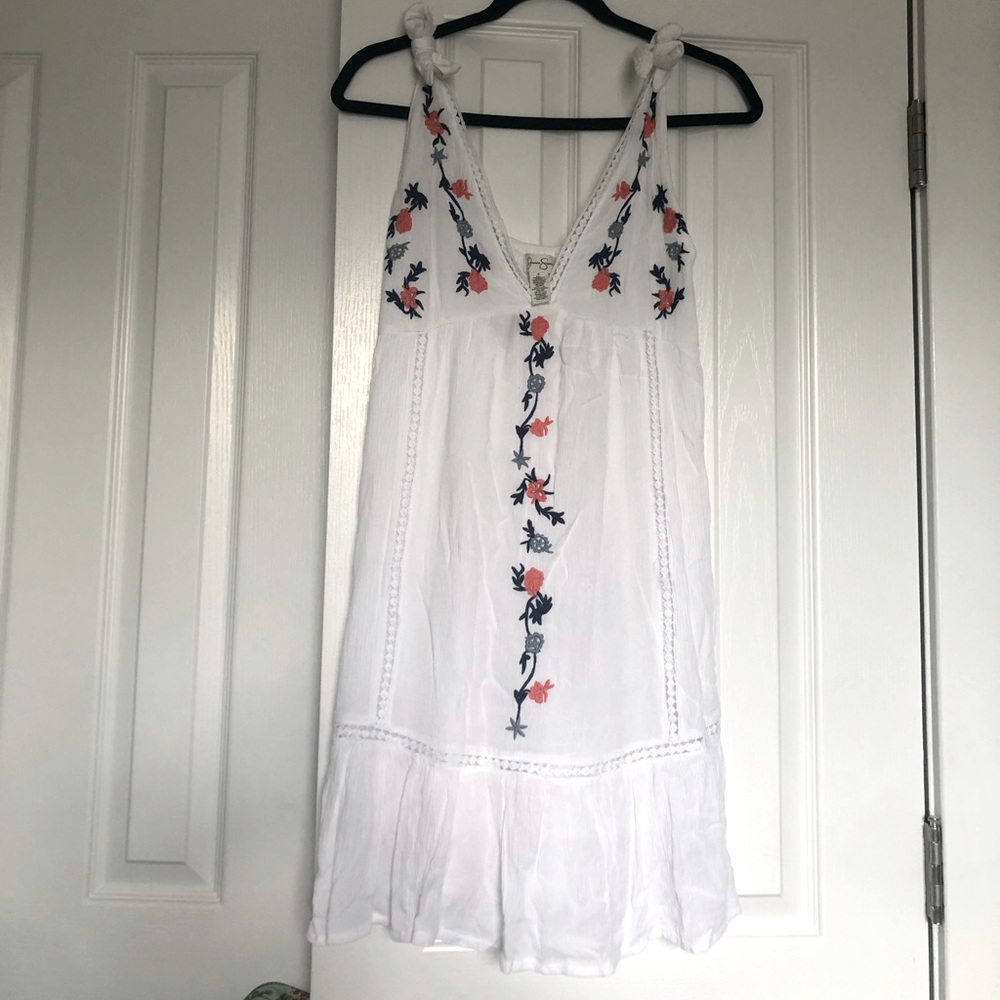 Cute white sundress with embroidered flowers. Only wore once.